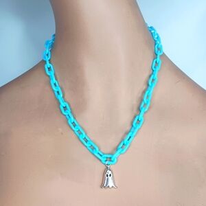 Plastic Bright Blue Link Necklace with Ghost Pendant.